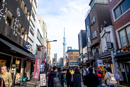 Tokyo, Japan - November 28, 2018: Crowd of people at Nakamise shopping street in Asakusa area of Tokyo with the background of tokyo skytree.のeditorial素材