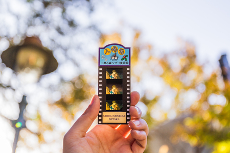 Tokyo, Japan - November 30, 2018: The entrance ticket to the Ghibli Museum was made by 35mm filmstrip from part of Ghibli Studio animation film.のeditorial素材