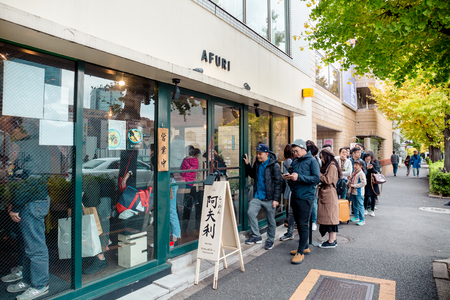 Tokyo, Japan - December 2, 2018: A long queue of people waiting at the Ramen restaurant called Afuri for their famous signature dish â Yuzu ramen.のeditorial素材
