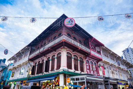 Chinatown, Singapore - 23 July 2019: Traditional Singapore shophouse with brown wooden shutters and...
