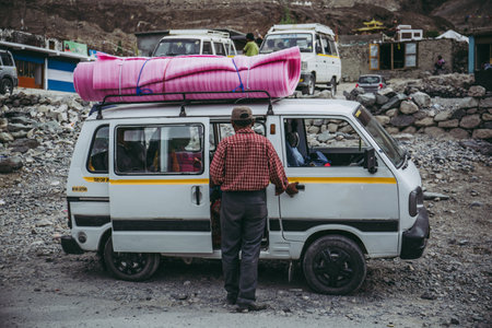 This type of mini van are the common private chartered to travel around the mountain region in Nubra Valley.のeditorial素材
