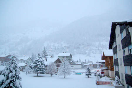 Morning snowing view in the town of Tasch, Switzerlandの写真素材