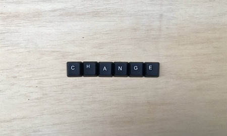 The word ganja spelled with black letter tiles on a wooden backgroundの写真素材