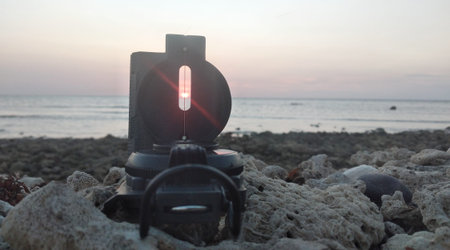 lamp on the beach in the evening, closeup of photo