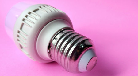 Energy saving LED light bulb on pink background. Energy saving concept.の写真素材