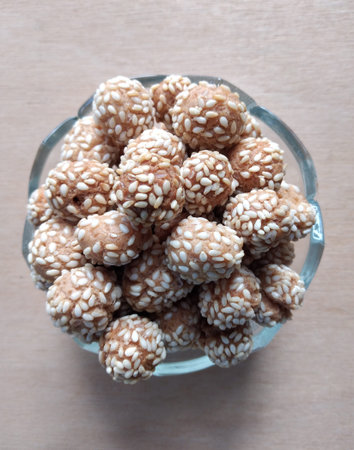Sesame cookies in glass bowl on wooden table. Top view.の写真素材