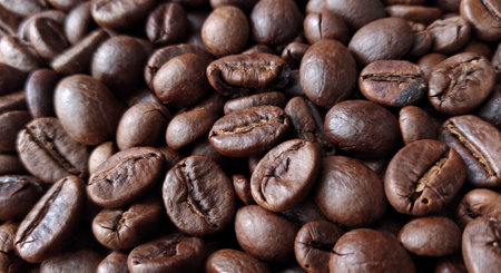 Coffee beans background. Close up of roasted coffee beans.
