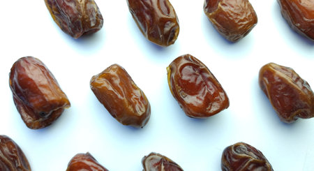 Dates fruit on white background. Top view. Flat lay.