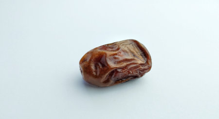 Dried dates on a white background. Selective focus. Food.
