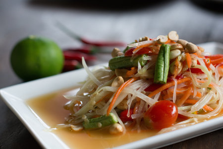 Som tum Thai : Green papaya salad is a spicy salad made from shredded unripe papaya. This is very...