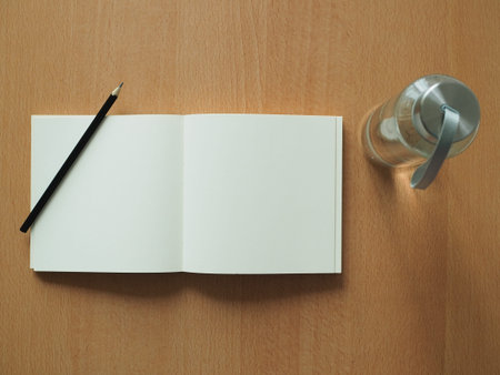 Flay lat empty opened book with pencil for mock upの写真素材