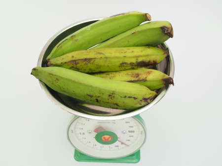 Bananas on weight scale. Suitable for groceries and fresh market conceptのeditorial素材
