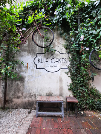 Kula Cakes  logo on exterior wall. The brand is well known hipster cafe at downtown Kuantan, Pahang, Malaysiaのeditorial素材