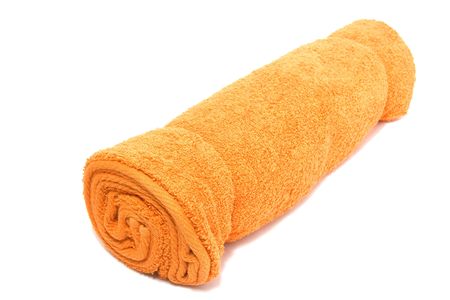 Yellow towel isolated on white.の写真素材