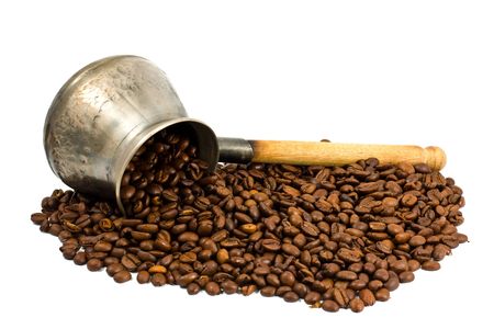 copper coffee pot with wooden handle isolated on whiteの写真素材