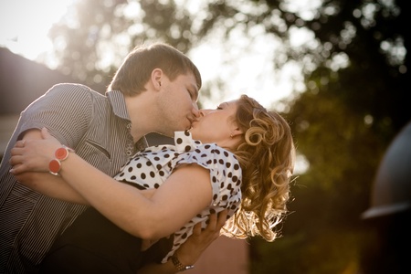 Exciting kiss of a young beautiful coupleの写真素材