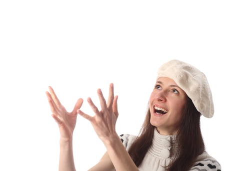 Happy young laughing woman looking up ready to catch, copyspace; isolated on whiteの写真素材