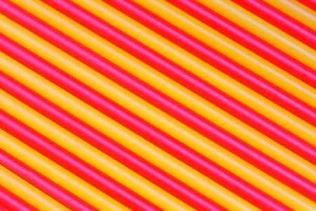Yellow and red straws for a cocktailの写真素材