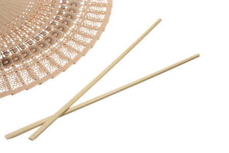 Chopsticks and fan isolated on whiteの写真素材
