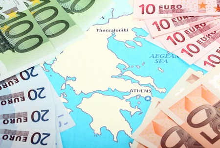 Europe helps Greece; euro banknotes on map of Europe around Greeceの写真素材