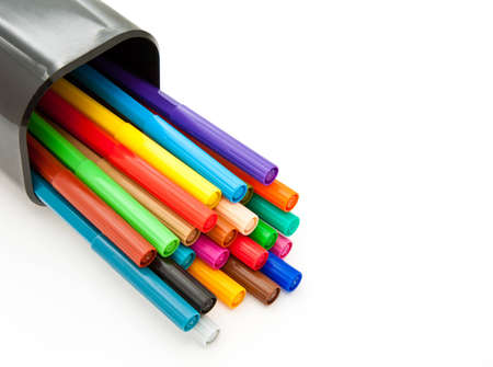 Diagonal fragment of closed colorful markers in the case pencil; white backgroundの写真素材