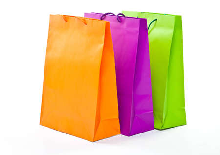 Multicolored paper bags isolated on whiteの写真素材