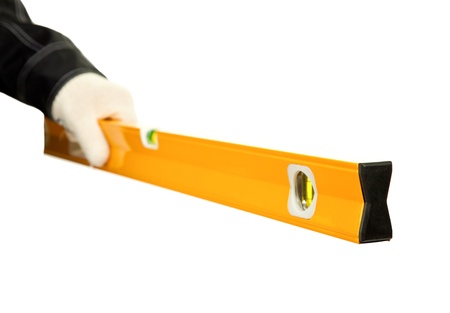 Hand of a worker holding gauge; closeup of a construction workerの写真素材