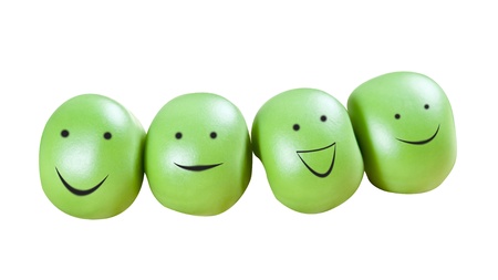 Funny smiling green pea balls isolated over white background with clipping pathの写真素材