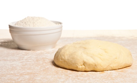 Kneading dough  close-up of dough portion on wooden tableの写真素材