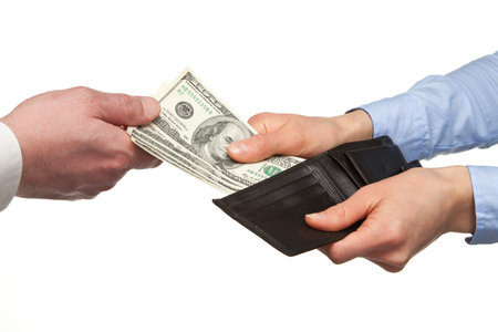 Paying money from a wallet - closeup shot of hands