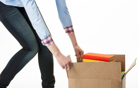 Woman carrying big box with books; isolated on white