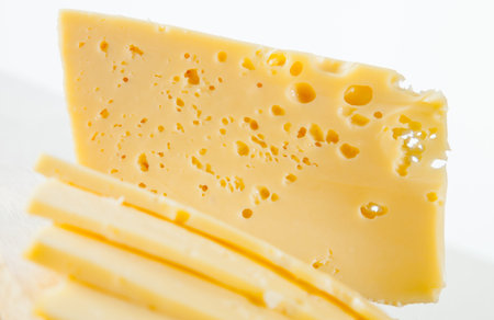 Cutting fresh cheese - healthy eating concept