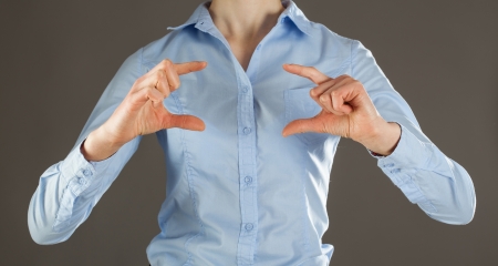 Unrecognizable young woman holding something - you can add your image thereの写真素材