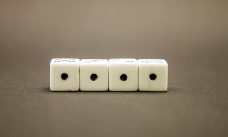 Four dice on dark backgroundの写真素材