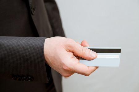 Businessman holding credit card - closeup shotの写真素材