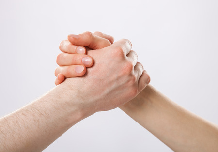 Handshake on grey backgroundの写真素材