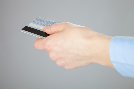 Businesswoman proposing plastic card, closeup shotの写真素材