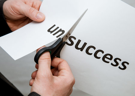 Man cutting inscription on a paper with scissors - closeup shot
