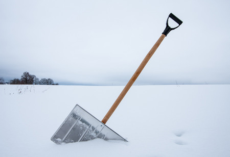 Removing snow with a shovelの写真素材