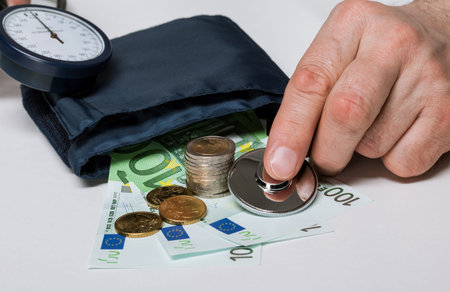 Expert trying to treat euro, macro shotの写真素材