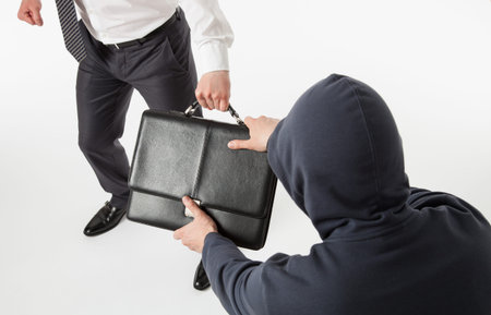 Unknown man take away a businessman's briefcase, white background
