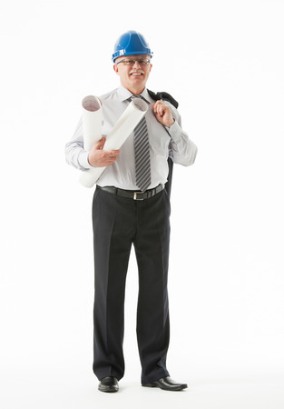 Happy mature businessman in a blue helmet holding projects, white backgroundの写真素材