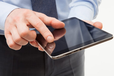 Businessman holding a pad, white background