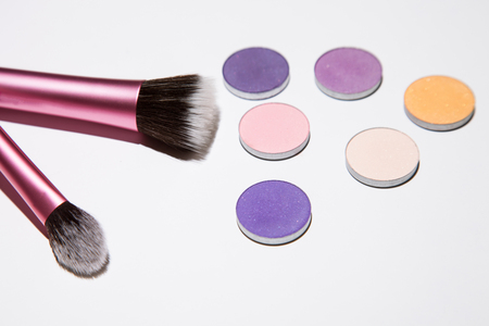 Cosmetic brushes and shadows, white backgroundの写真素材