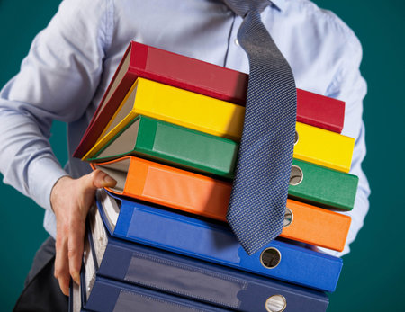 Businessman giving folders to you, closeup shot