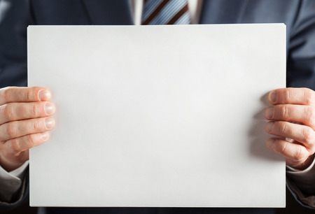 Businessman holding blank paper, copy spaceの写真素材