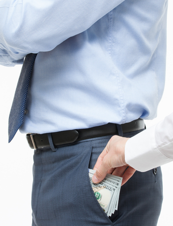 Female hand giving a bribe to businessman - closeup shotの写真素材