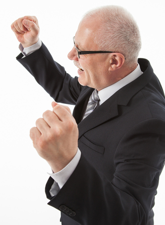 Portrait of a delighted mature businessman, white backgroundの写真素材