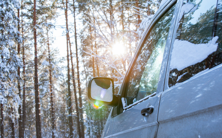 Fragment of a car in winter forest - closeup shotの写真素材