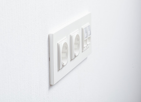Socket in the white wall, closeup shotの写真素材
